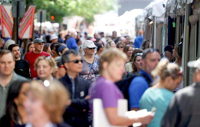 Visitors crowd downtown Fort Worth during the second day of the Main Street Arts Festival on Friday, April 21, 2023.